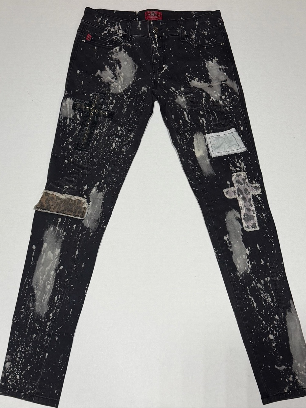 Royal Bones Black Jeans with edgy cross patchwork and Paint-Splash design